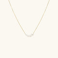 Collier de perles nacrées sur fil doré