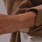 Bracelet à volumes géométriques alternés, acier doré