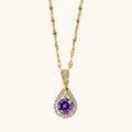 Collier à pierre violette taille goutte sur chaîne dorée