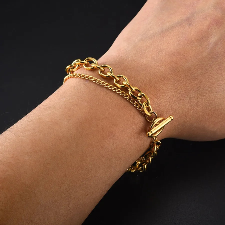 Bracelet maille ondulée à fermoir en T, acier doré