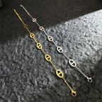 Bracelet aux lignes géométriques en acier titane