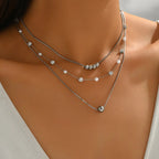 Collier de perles rondes à fermoir argenté