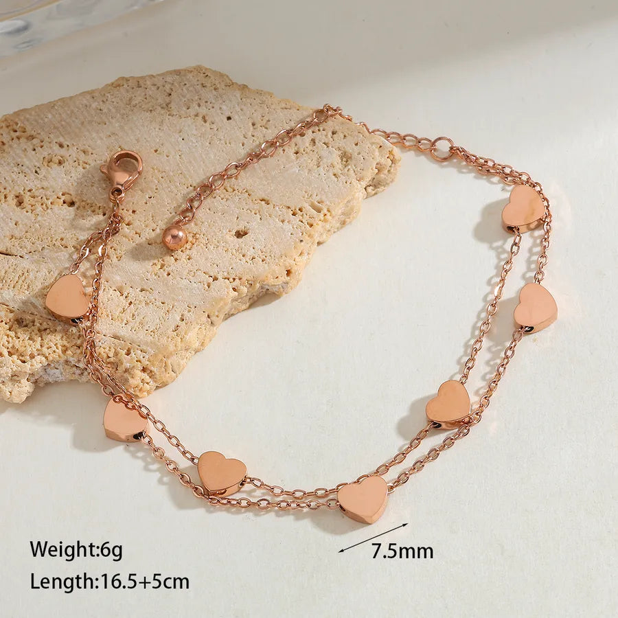 Collier à petits cœurs en relief, acier doré — vue 10