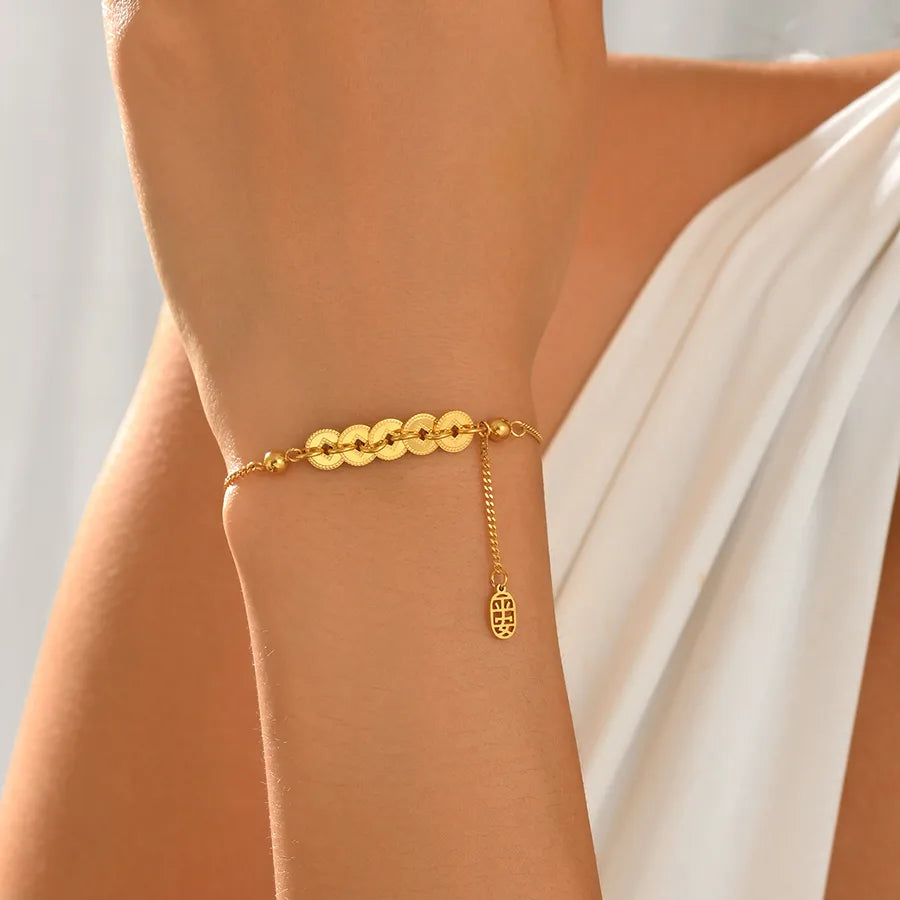 Bracelet anneau décentré sur chaîne fine, acier doré