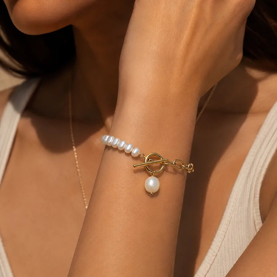 Bracelet à maillons géométriques et perle, acier doré