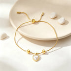 Bracelet cœur et perle sur chaîne réglable, acier doré
