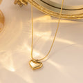 Collier cœur sur maille serpent lisse, acier doré — vue 4