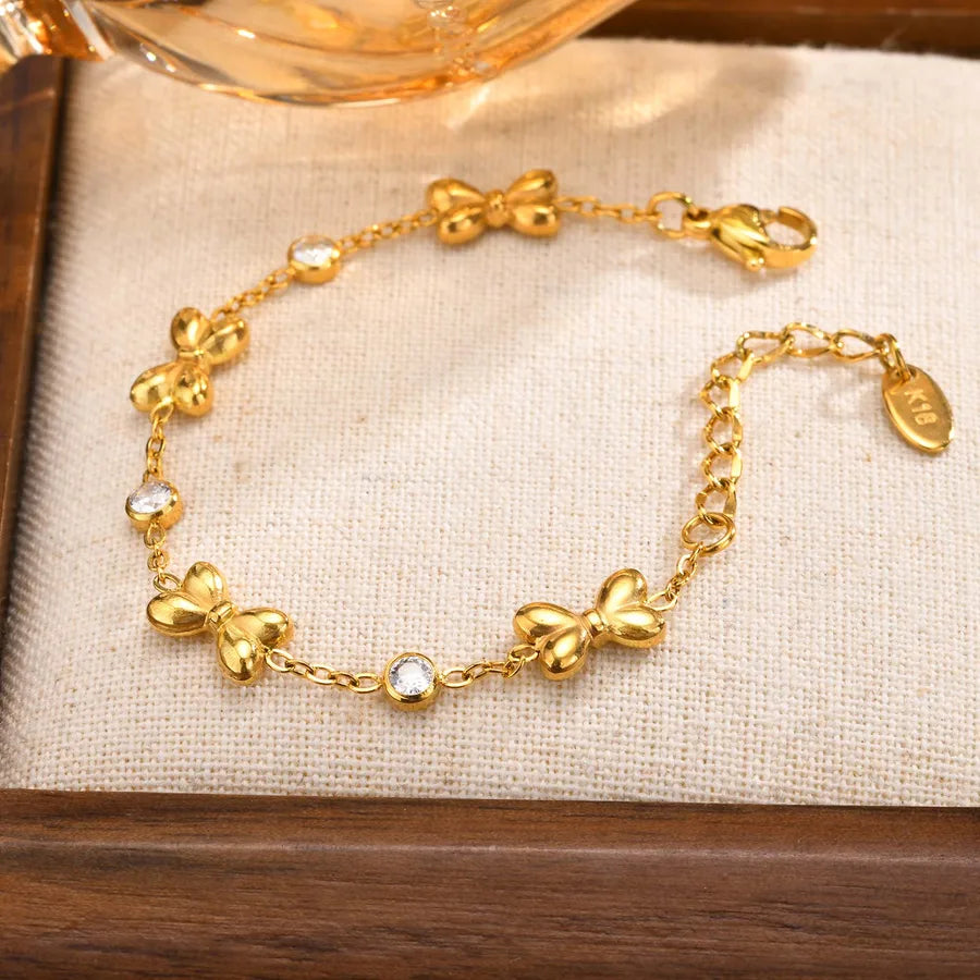Bracelet cœur et nœud papillon, chaîne dorée — vue 3