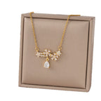 Collier fleur dorée sur chaîne en acier inoxydable 304