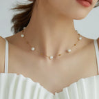 Collier à perle sur chaîne en acier titane doré