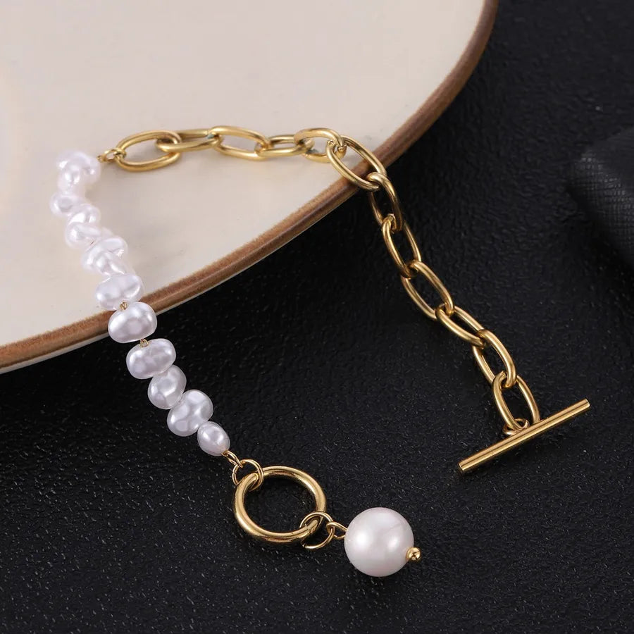 Bracelet perle et maille trombone allongée, acier doré
