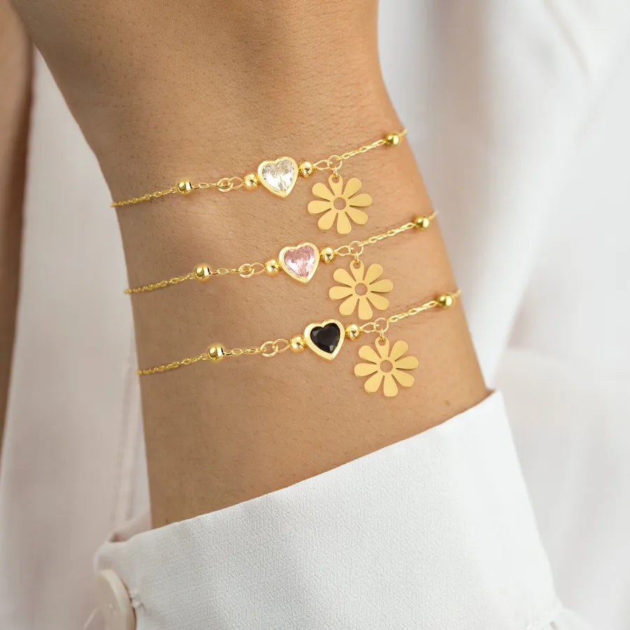 Bracelet marguerites émaillées sur chaîne dorée