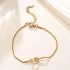 Bracelet maille serpent nouée sur elle-même, acier doré