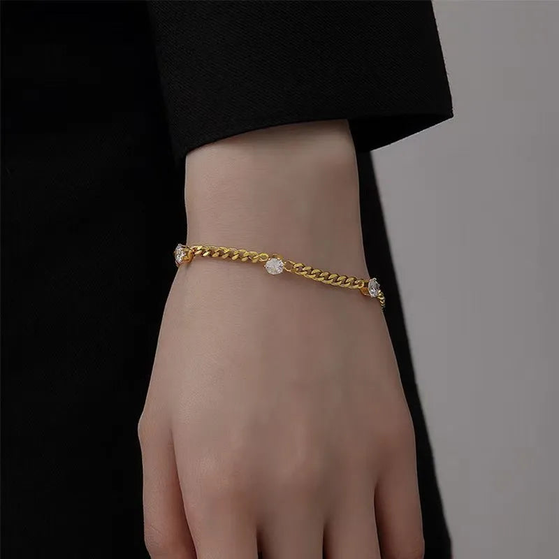 Bracelet à maillons facettés, acier doré — vue 2