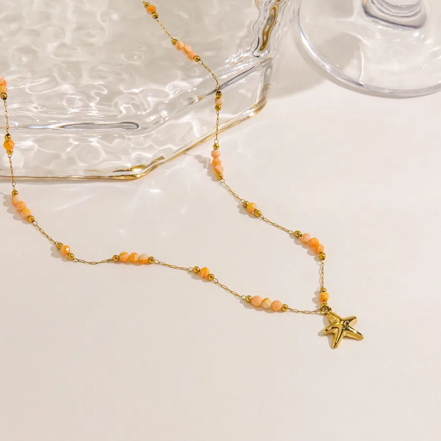 Collier étoile de mer, chaîne fine dorée — vue 3