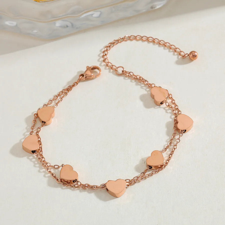 Collier à petits cœurs en relief, acier doré — vue 8