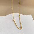 Collier à petits cœurs en relief, acier doré — vue 9
