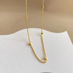 Collier à petits cœurs en relief, acier doré — vue 9