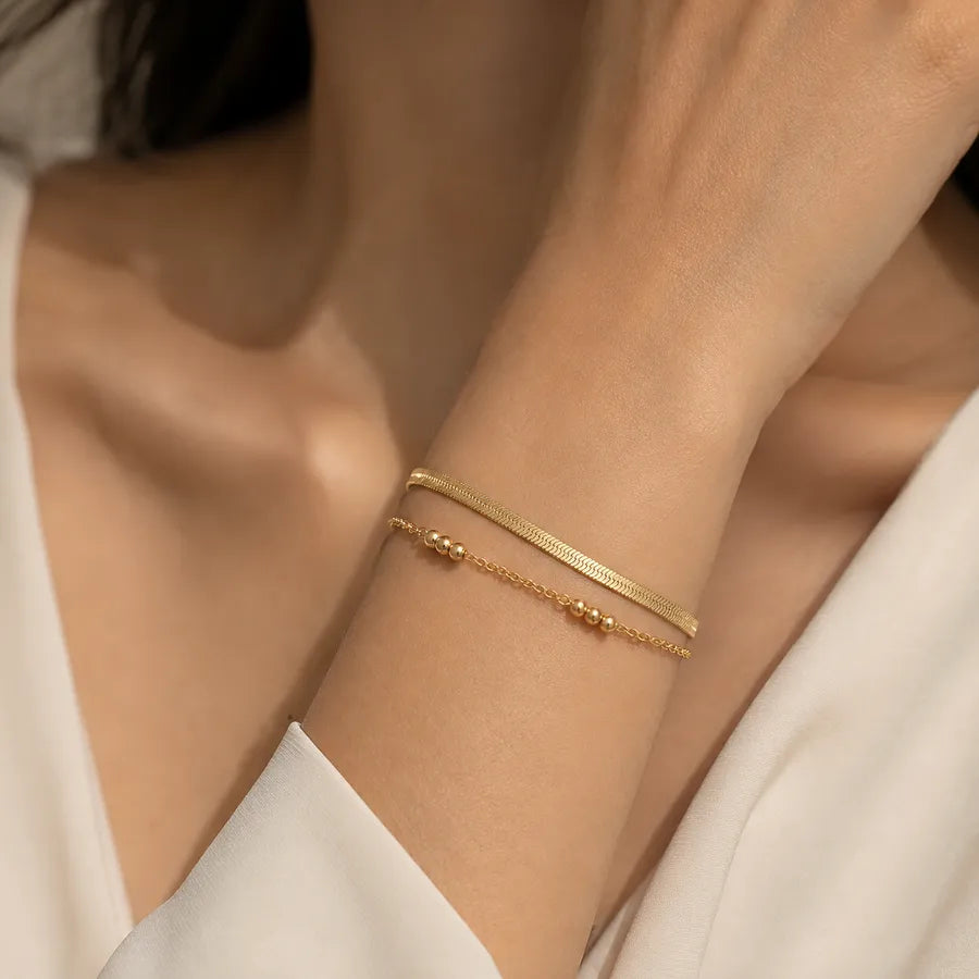 Bracelet maille forçat aux maillons anguleux, acier doré
