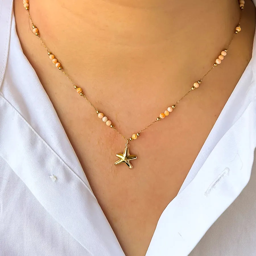 Collier étoile de mer sur chaîne fine dorée