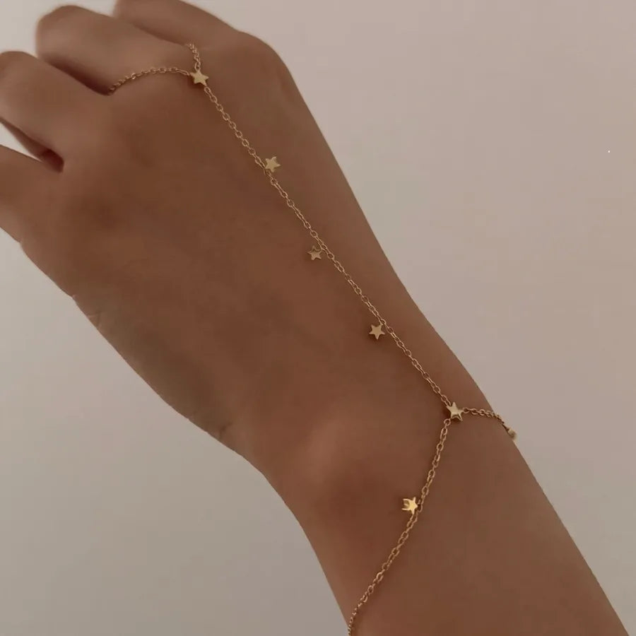 Bracelet étoile sur chaîne fine en acier inoxydable doré